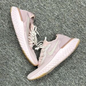 Nike Pink and White Sneakers with Sleek Design